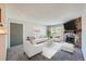 Living room with fireplace, staged furniture, and carpet at 1777 S Pitkin St # B, Aurora, CO 80017