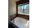 Bathroom with large bathtub and window overlooking backyard at 15626 Greenstone Cir, Parker, CO 80134