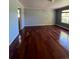 Spacious living room featuring hardwood floors and lots of natural light at 15626 Greenstone Cir, Parker, CO 80134