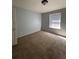 Bright bedroom with neutral walls and carpeted floor at 15626 Greenstone Cir, Parker, CO 80134