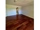 Bright bedroom with hardwood floors and access to bathroom at 15626 Greenstone Cir, Parker, CO 80134