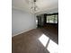 Spacious dining area with hardwood floors and access to kitchen at 15626 Greenstone Cir, Parker, CO 80134