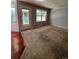 Bright living area with hardwood and carpeted floors and view to backyard at 15626 Greenstone Cir, Parker, CO 80134