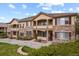 Multi-unit building featuring stone and siding accents with landscaping at 22960 E Roxbury Dr # G, Aurora, CO 80016