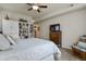 Main bedroom with built-in shelving and a large window at 22960 E Roxbury Dr # G, Aurora, CO 80016
