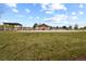 Community pool with grassy area and a covered patio at 22960 E Roxbury Dr # G, Aurora, CO 80016
