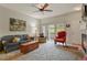 Bright living room with fireplace, comfy seating, and access to a balcony at 22960 E Roxbury Dr # G, Aurora, CO 80016