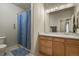 Clean bathroom with light wood vanity and shower/tub combo at 22960 E Roxbury Dr # G, Aurora, CO 80016