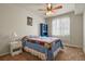 Bright bedroom with carpeted floor, ceiling fan, and window coverings at 22960 E Roxbury Dr # G, Aurora, CO 80016