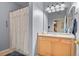 Clean bathroom with light wood cabinets and a shower/tub combo at 22960 E Roxbury Dr # G, Aurora, CO 80016