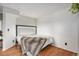 Bright bedroom with hardwood floors and a unique headboard at 8701 Huron St # 1-210, Thornton, CO 80260