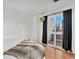 Bedroom with a private balcony and black-out curtains at 8701 Huron St # 1-210, Thornton, CO 80260