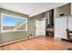 Living room with a fireplace and wood flooring, view of the front door at 8701 Huron St # 1-210, Thornton, CO 80260