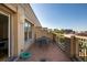 Outdoor patio with a table, chairs, and city views at 1560 Blake St # 810, Denver, CO 80202