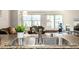 Stainless steel double sink with granite countertop, overlooking living room at 1560 Blake St # 810, Denver, CO 80202