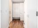 Clean hallway with hardwood floors and built-in storage at 1560 Blake St # 810, Denver, CO 80202