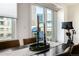 Modern dining area with city views and balcony access at 1560 Blake St # 810, Denver, CO 80202