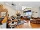 Spacious living room featuring hardwood floors, a fireplace, and ample natural light at 306 Andrea Cir, Parker, CO 80138