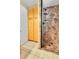 Bathroom with a shower and wooden cabinets at 17769 E Iowa Dr, Aurora, CO 80017