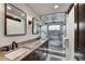 Elegant bathroom with double vanity, large shower, and marble tile at 141 Shekel Ln, Breckenridge, CO 80424