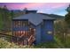 Modern mountain home exterior at sunset, highlighting its unique design at 141 Shekel Ln, Breckenridge, CO 80424