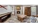 Game room with stone fireplace, seating, and shuffleboard table at 141 Shekel Ln, Breckenridge, CO 80424