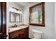 Modern bathroom with wood vanity, granite countertop, and a window at 141 Shekel Ln, Breckenridge, CO 80424