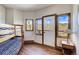 Bunk beds in a bright bedroom with mountain views and hardwood floors at 141 Shekel Ln, Breckenridge, CO 80424