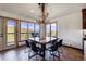 Spacious dining area featuring a unique wood table and breathtaking mountain views at 141 Shekel Ln, Breckenridge, CO 80424