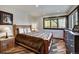 Charming bedroom with a rustic bed and mountain views at 141 Shekel Ln, Breckenridge, CO 80424