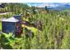 Luxury home nestled in a mountain neighborhood, showcasing a large deck and mountain views at 141 Shekel Ln, Breckenridge, CO 80424