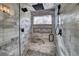 Spa-like shower with marble tile, built-in bench, and dual shower heads at 141 Shekel Ln, Breckenridge, CO 80424