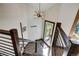 Bright and airy entryway with wooden staircase and access to a deck at 141 Shekel Ln, Breckenridge, CO 80424