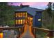 Modern home with walkway and mountain views at dusk at 141 Shekel Ln, Breckenridge, CO 80424