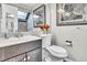 Bathroom with vanity, toilet, and skylight at 12474 W Nevada Pl # 211, Lakewood, CO 80228