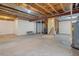 Unfinished basement with open space and exposed beams at 7353 Norfolk Pl, Castle Pines, CO 80108