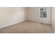 Simple carpeted bedroom with a window at 7353 Norfolk Pl, Castle Pines, CO 80108
