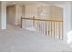 Spacious loft area with carpet and a view to the lower floor at 7353 Norfolk Pl, Castle Pines, CO 80108