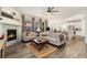 Cozy living room featuring a fireplace and ample natural light at 810 Compass Dr, Erie, CO 80516