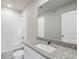 Clean bathroom with granite countertop and white tile at 7203 Dolores Ave, Frederick, CO 80530