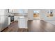 Open concept kitchen with island and view to backyard at 7203 Dolores Ave, Frederick, CO 80530
