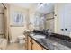 Bathroom with granite countertop and updated fixtures at 7041 S Quince St, Centennial, CO 80112