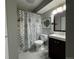 Updated bathroom with a tub shower, toilet and vanity at 4400 S Quebec St # C105, Denver, CO 80237