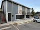 Exterior view of a building with parking and stairs at 4400 S Quebec St # C105, Denver, CO 80237