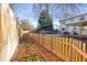 Landscaped garden with raised beds and wooden fence at 6431 W Arbor Ave, Littleton, CO 80123