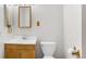 Simple bathroom, with sink, toilet, and mirror at 5122 Williams Fork Trl # 201, Boulder, CO 80301