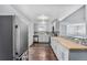 Updated kitchen featuring gray cabinets and butcher block countertops at 206 Cedar St, Hudson, CO 80642