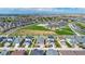 Aerial view showing a house in a new neighborhood near a school at 18000 E 100Th Ave, Commerce City, CO 80022