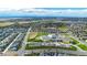 Aerial view of a neighborhood, highlighting a school and recreational areas at 18000 E 100Th Ave, Commerce City, CO 80022