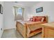 Cozy bedroom with wood furniture and neutral color scheme at 18000 E 100Th Ave, Commerce City, CO 80022